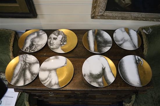 A group of eight Fornasetti plates, Diam.26cm